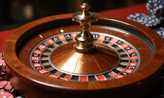 Roulette wheel with ball and chips
